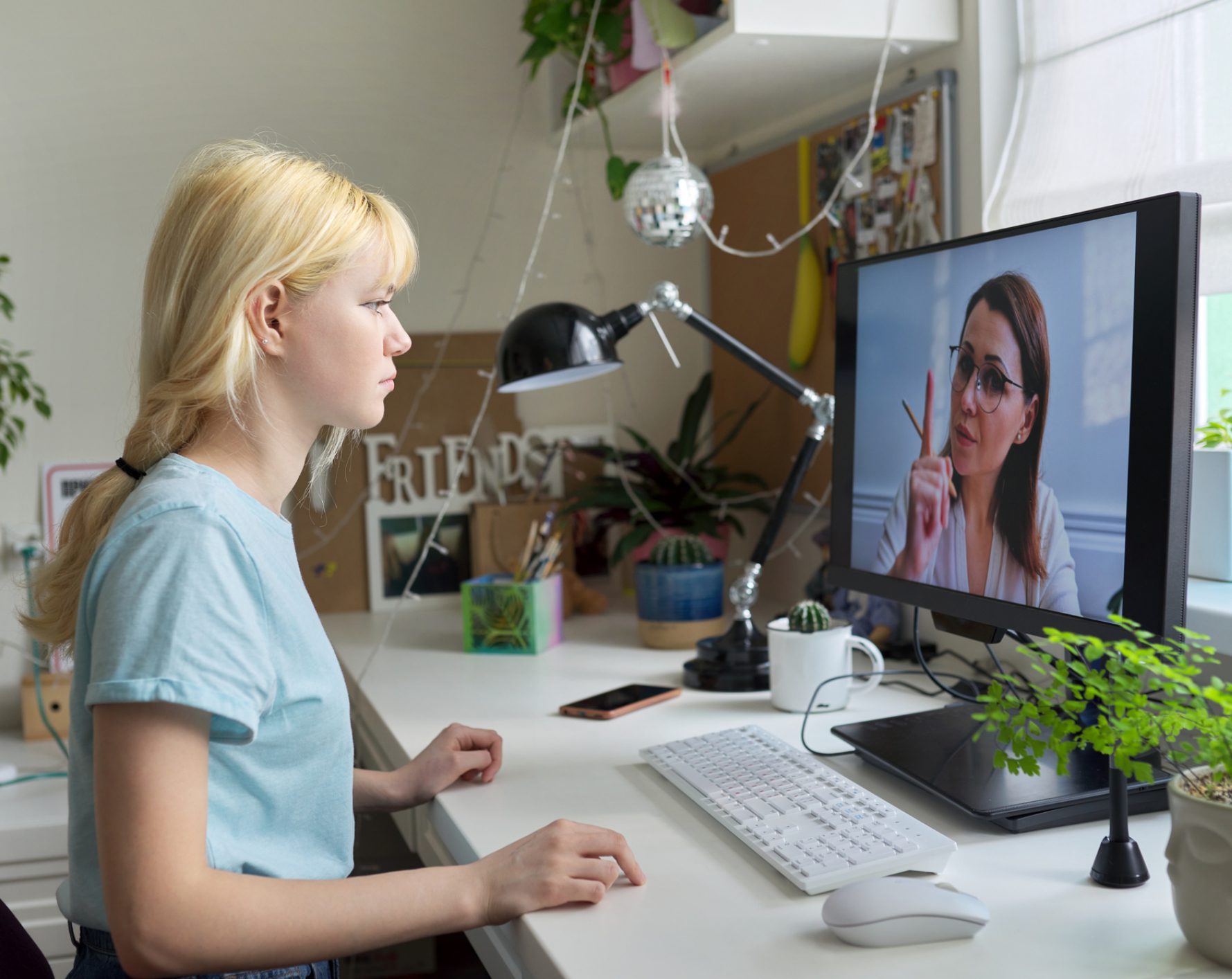Person on video call with woman on screen