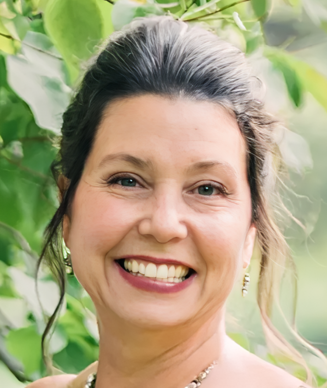 Close-up portrait of smiling woman outdoors